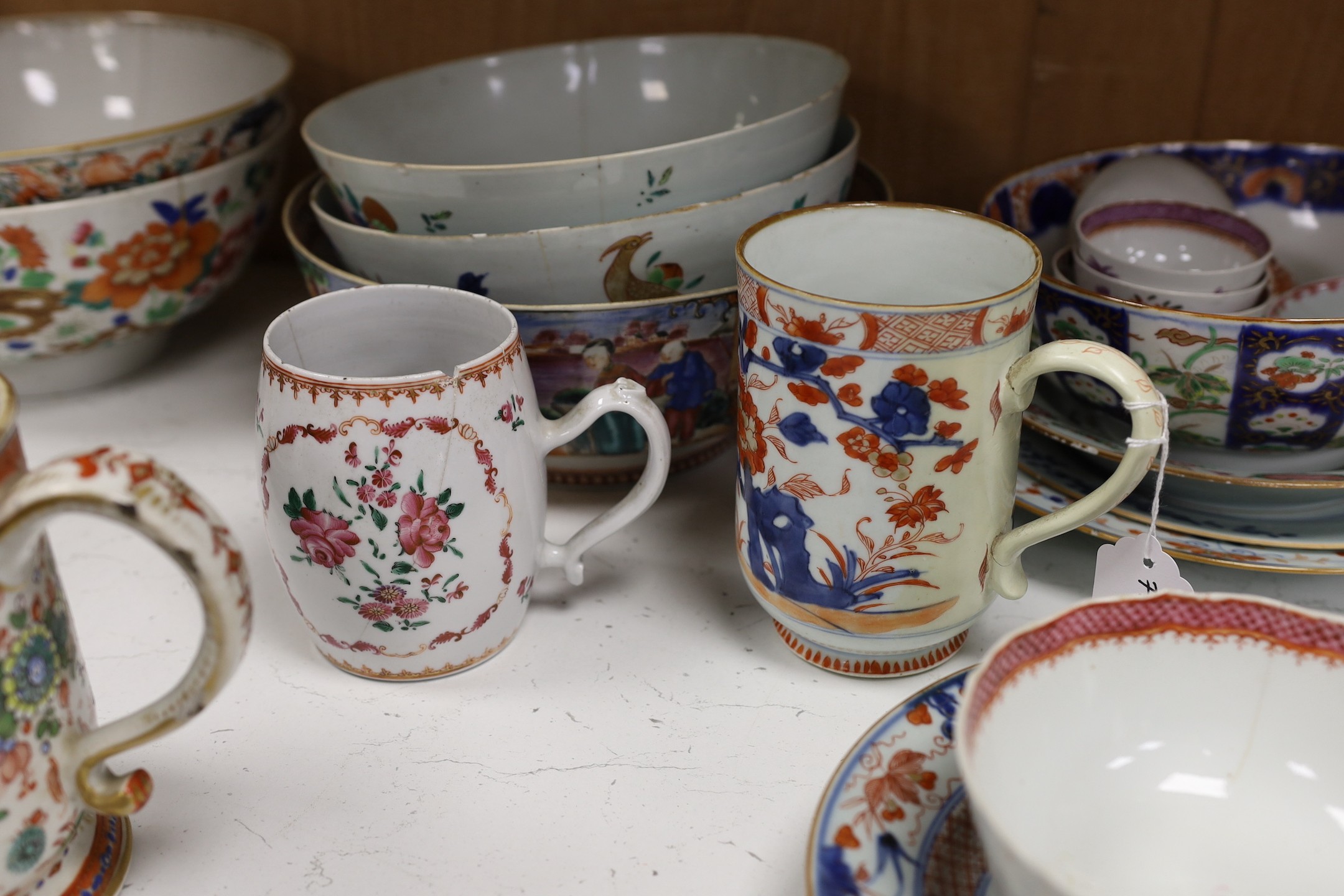 A large selection of 18th century Chinese export porcelain bowls, plates and mugs a/f